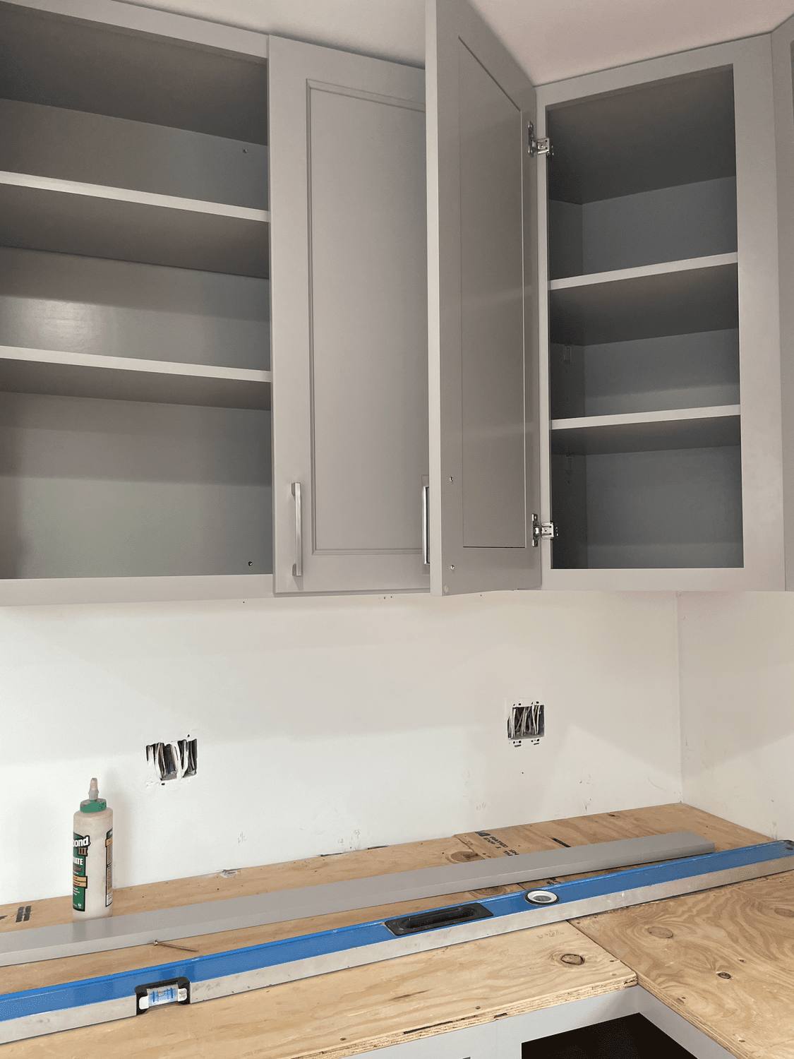 Upper cabinets installed with countertop substrate prepared below